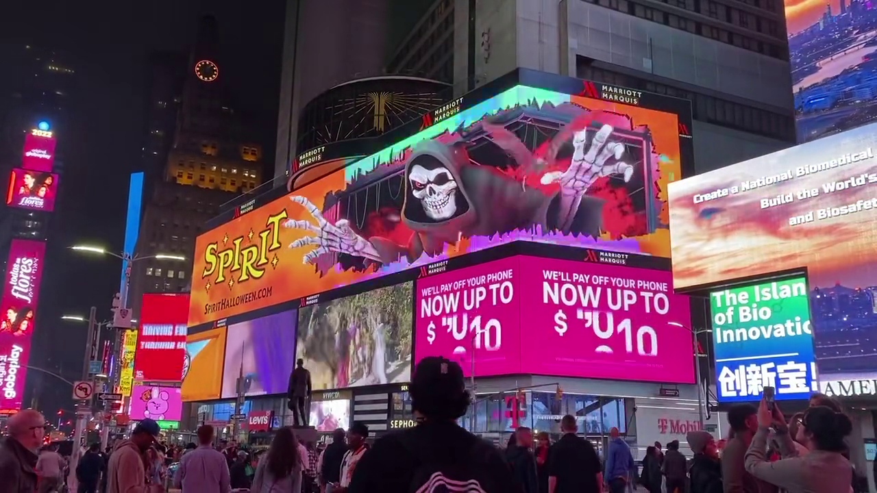 Spirit Halloween Times Square billboard frame shown at night.